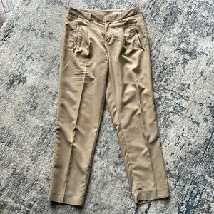 Silky pleated tan trousers with zip pockets, ankle length